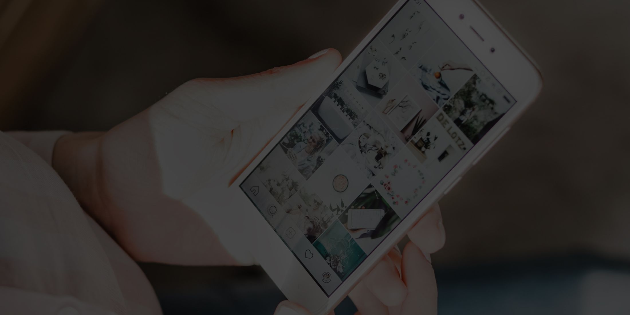 Person holding smartphone displaying social media feed.