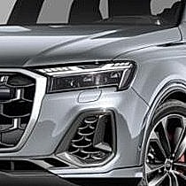 Modern gray SUV front view with stylish details.