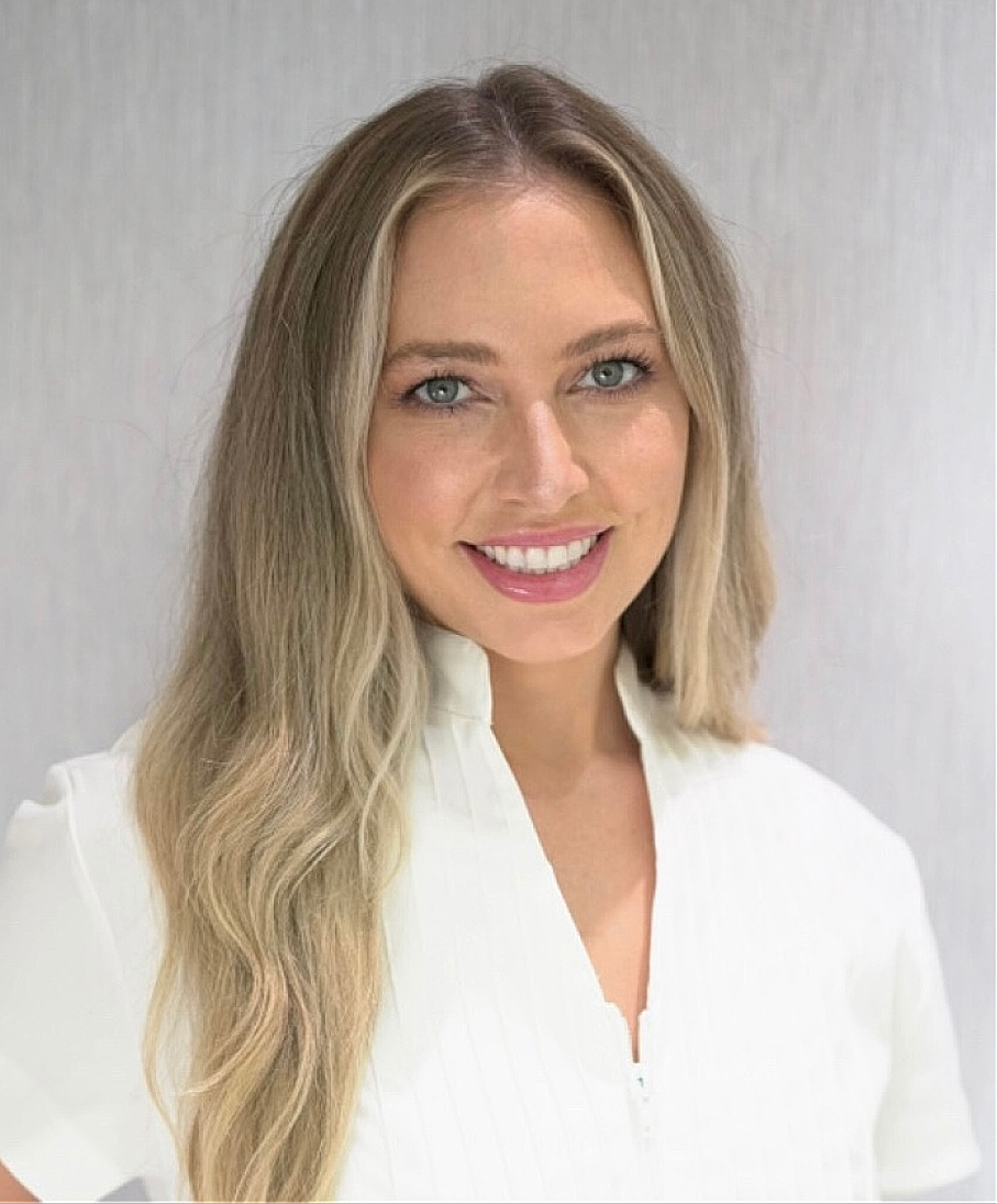 Smiling woman in a professional setting.